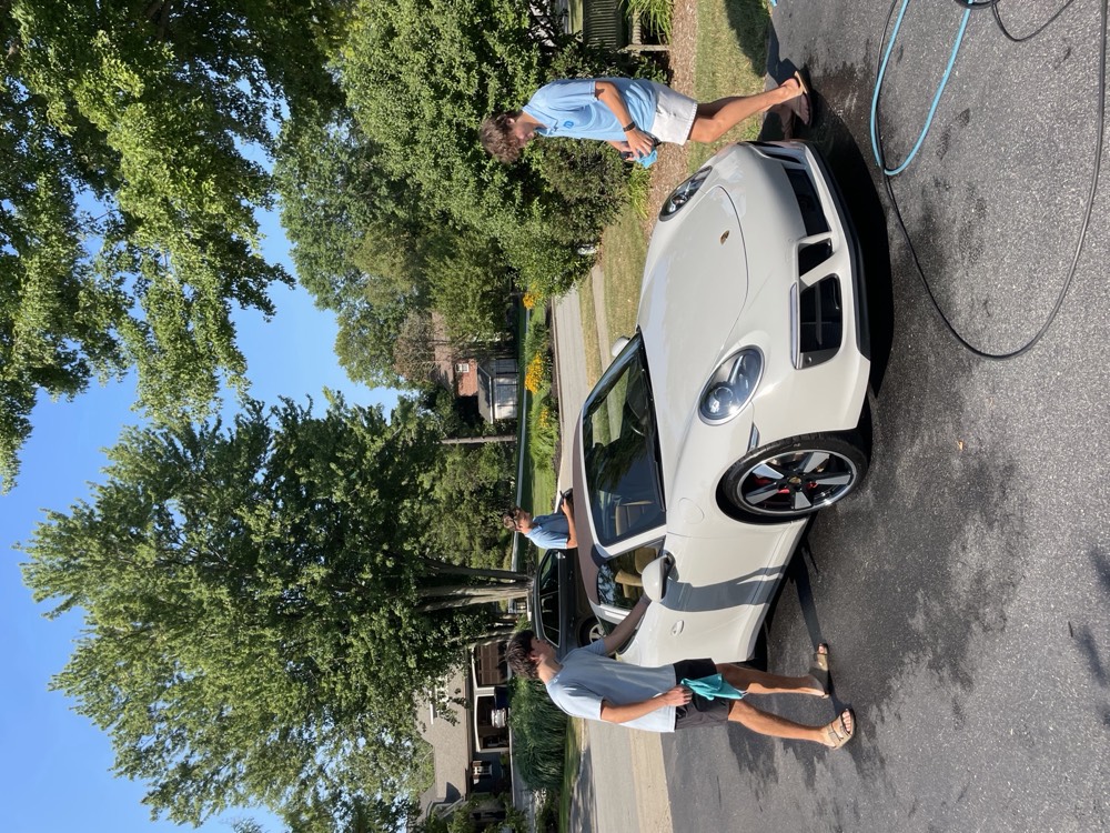 Porsche 911 Carrera GTS cabriolet hand washed in the driveway